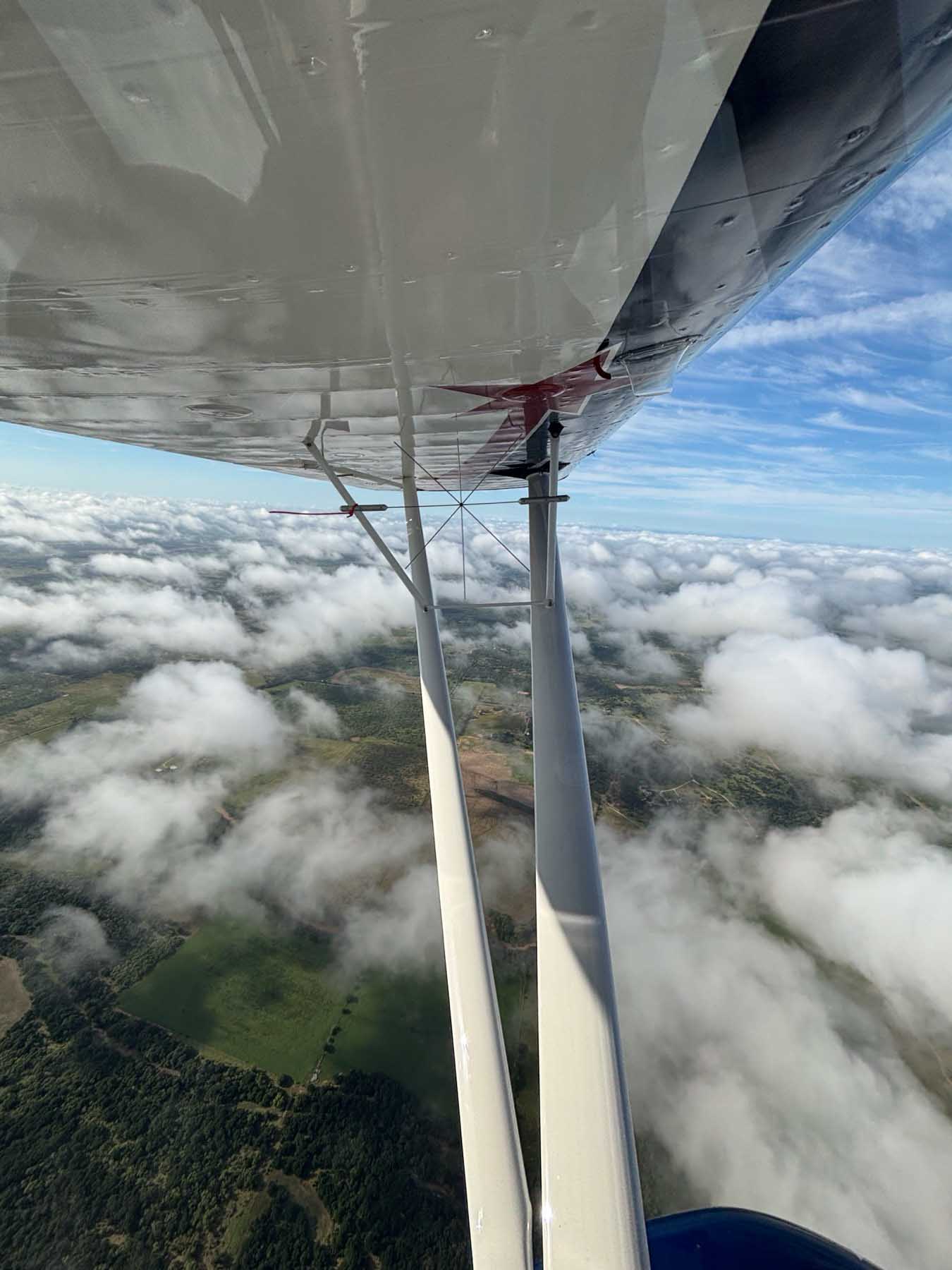 Super Decathlon N207JJ — wing in flight