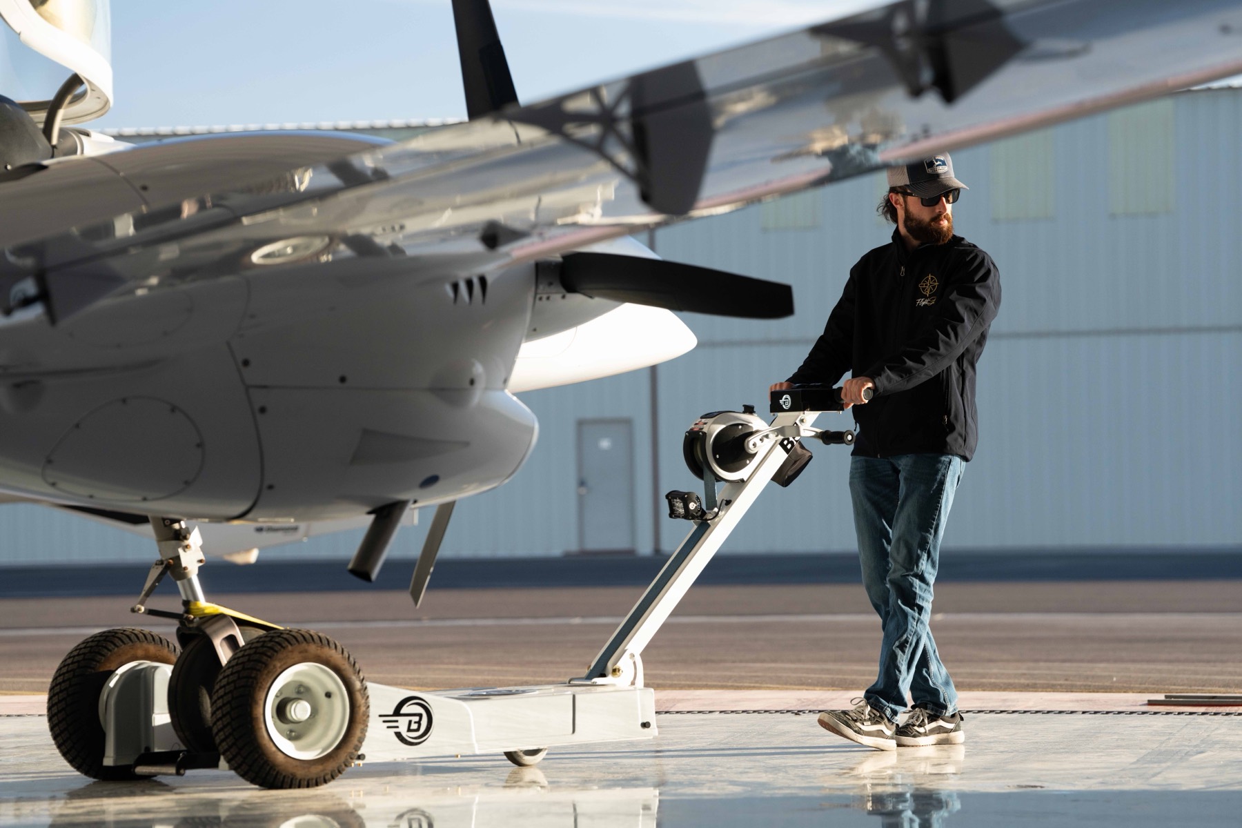 Flight Stars instructor towing the Diamond DA42 out of the hangar — Zero to Hero career pathway